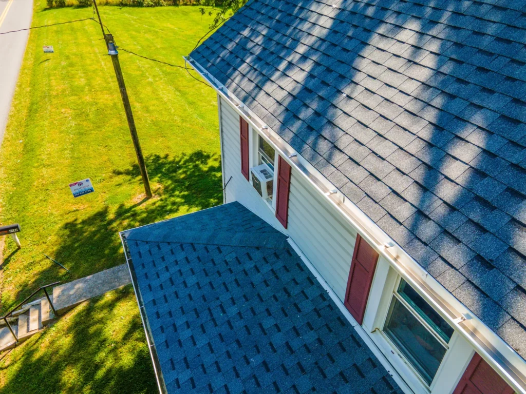 Aerial view of a residential home with white gutters installed representing gutter services in Martinsburg and Hagerstown